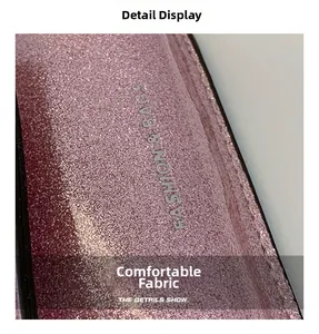 Macro shot of pink glitter fabric detail on children's bag with Fashion text