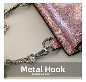 Detail of high-quality silver metal hook and pink sequin fabric on kids shoulder bag
