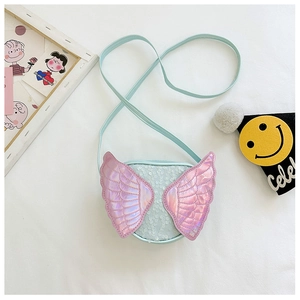 Detail of light blue sequin kids bag with holographic wings and smooth shoulder strap