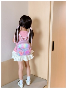 Detail of purple sequin kids backpack with pearl handle and laser-cut wings
