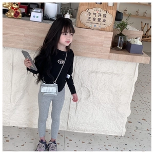 Fashionable silver chain crossbody bag for kids styled with casual autumn outfit