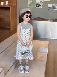 Detail of silver laser saddle bag paired with stylish children's fashion outfit