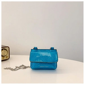 Detail of glitter blue mini crossbody bag with silver chain and Fashion & Bags text