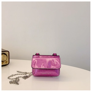 Detailed view of purple sequin crossbody bag with silver chain and magnetic flap
