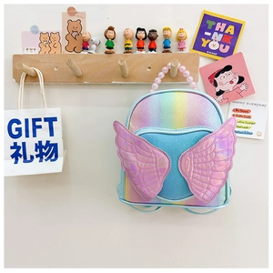 Detailed macro view of rainbow sequin backpack with purple wings and pearl handle