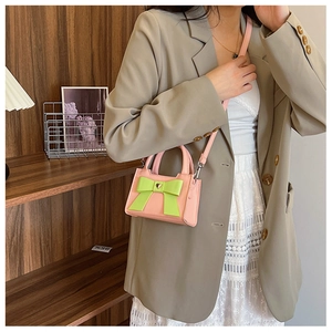 Mini borsa rosa in pelle PU per bambini con fiocco verde neon e chiusura a cuore