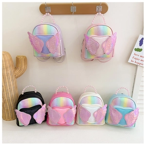 Detailed display of assorted colorful sequin schoolbags with angel wings and pearl handles