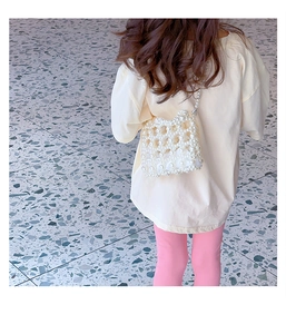 Detail of handcrafted white pearl beaded crossbody bag for kids with inner fabric lining