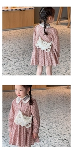 Detail view of a white pearl beaded crossbody bag for kids with intricate hollow design
