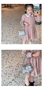 Detail of children's white pearl woven crossbody bag with hollow grid and lace dress