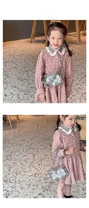 Detail of white pearl woven mini bag paired with a floral cotton girl's dress set