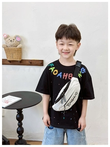 Close-up of child wearing a white waist bag with black TONGHUO lettering and adjustable strap