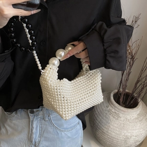 Elegant hand-woven pearl tote bag with black contrast strap for women's vintage style