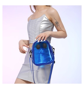 Detail of blue transparent jelly bag with cartoon eyes and metallic silver outfit
