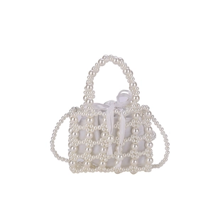 Elegant girls' hollow pearl beaded handbag with white satin drawstring lining and bow