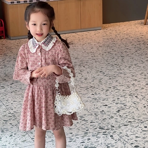 Fashionable girls cherry print dress with a white hollow pearl shoulder bag