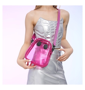 Pink transparent PVC shoulder bag featuring cute eye design on a silver outfit model