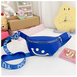 Detailed macro view of kids blue waist bag featuring a white smiley face and wide strap