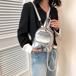Chic silver mini backpack with punk rivets and cross pendant for fashionable women