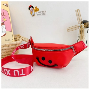 Close-up of red kids fanny pack with smile face embroidery and printed strap