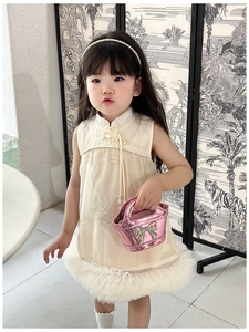 Detail of laser shiny pink bow shoulder bag accessory for kids casual dresses