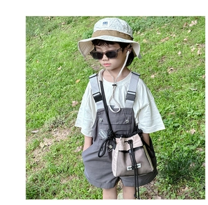 Outdoor look of kids drawstring crossbody bag with beige mesh and utility shorts