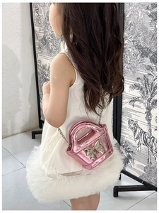 Pink laser finish girls crossbody bag with metallic bow and elegant chain strap details