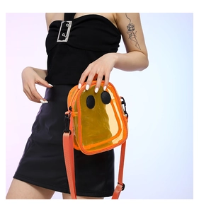 Detail of orange transparent PVC crossbody bag with ghost eyes and nylon shoulder strap