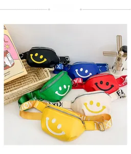 Detailed view of colorful kids fanny packs with smiley faces and adjustable straps