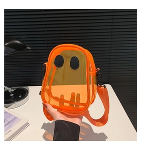 Detail of cute orange transparent PVC crossbody bag with ghost face and nylon strap