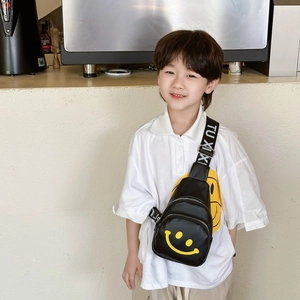 Kids black leather chest bag with yellow smiley face and branded strap for daily use