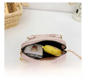 Pink shell jelly bag detail showing internal capacity for mirror and headphones