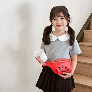 Kids red waist bag featuring a minimalist black smiley face and adjustable strap