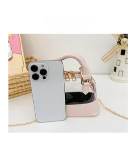 Pink shell-shaped jelly bag shown next to a smartphone to illustrate its mini size