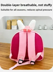 Breathable honeycomb mesh back padding on cute pink rabbit backpack for spinal comfort