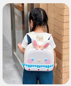 Detailed view of kids cartoon bunny backpack with long ears and cute bow detail
