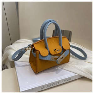 Detail of mini crossbody bag in orange litchi grain leather with blue handle and gold lock