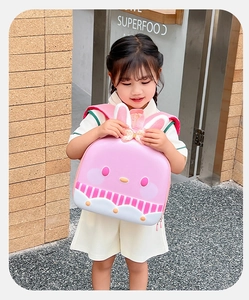 Pink cartoon rabbit backpack for kids featuring waterproof shell and cute ears detail