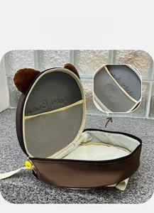 Detail of the brown bear backpack inner mesh pocket for organized nursery storage
