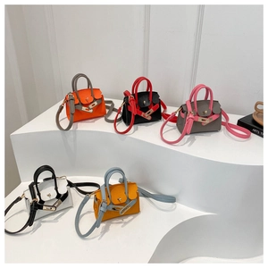Miniature crossbody bags in five colors with lychee grain leather and metal lock detail