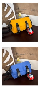 Detailed comparison of bright yellow and royal blue kids messenger bags with buckle straps