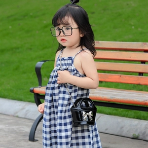 Girls black shiny leather crossbody bag with silver bow and metal chain strap