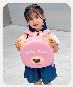 Pink cartoon bear backpack with 3D ears and Baby Bear print shown by child model