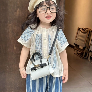 Chic white lychee leather mini crossbody bag for girls with stylish black top handle