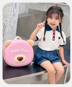 Close-up of pink hardshell backpack with 3D bear ears and Baby Bear embroidery for kids