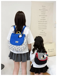 Parent-child matching backpacks set featuring blue floral and plaid patterns with cute puppy charms
