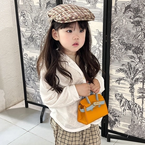 Girl's mini crossbody bag in orange and blue color block with top handle design