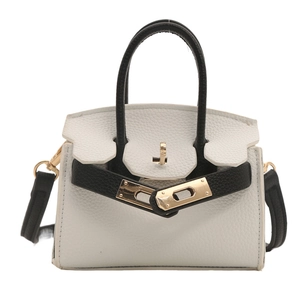 Mini bicolor cross-body bag for girls with black and white leather and gold hardware
