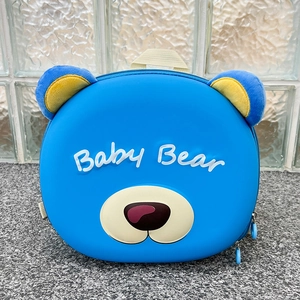 Close-up of blue bear hard shell schoolbag with plush ears and Baby Bear text