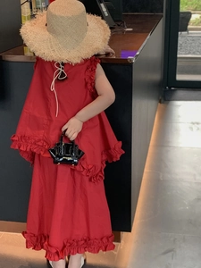 Detail of red sleeveless ruffle top and long skirt set for girls with back lace-up design